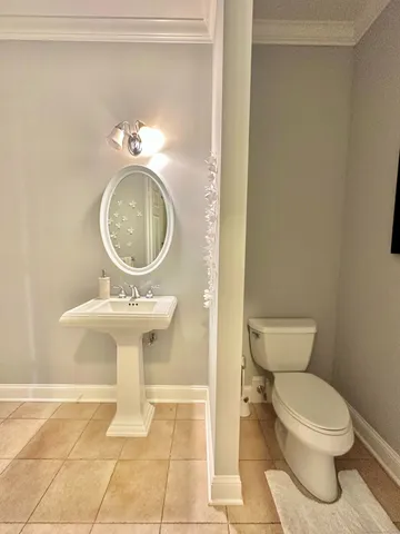 a bathroom with a toilet and a sink