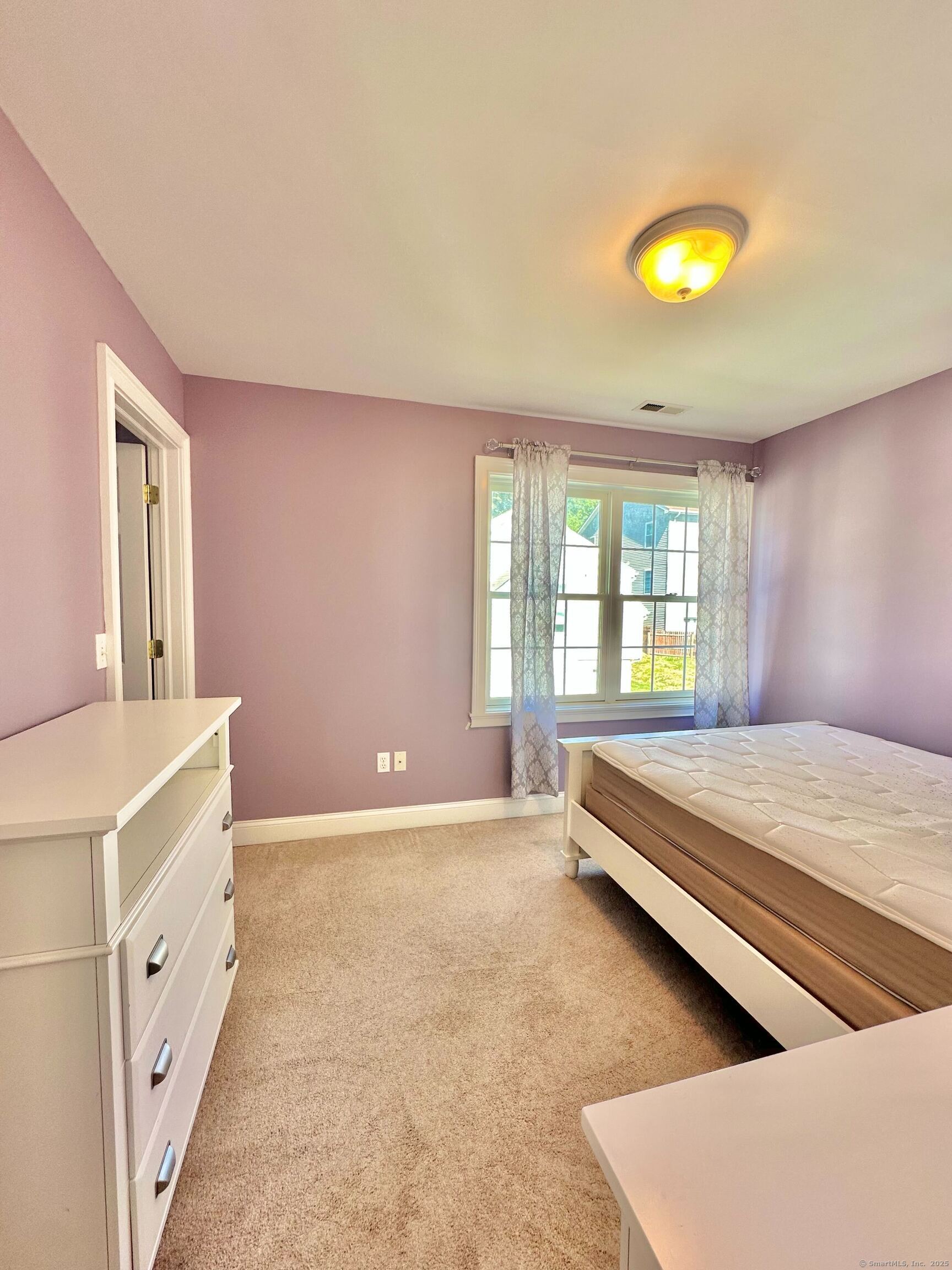 564 Black Rock Turnpike, Unit 564 Fairfield, CT 06825 - Photo 17 of 24 a spacious bedroom with a bed and a window