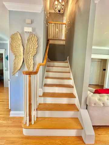 a view of entryway and hall with wooden floor