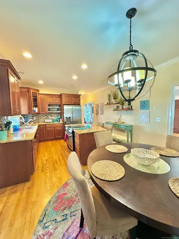 a living room with dining table and couches