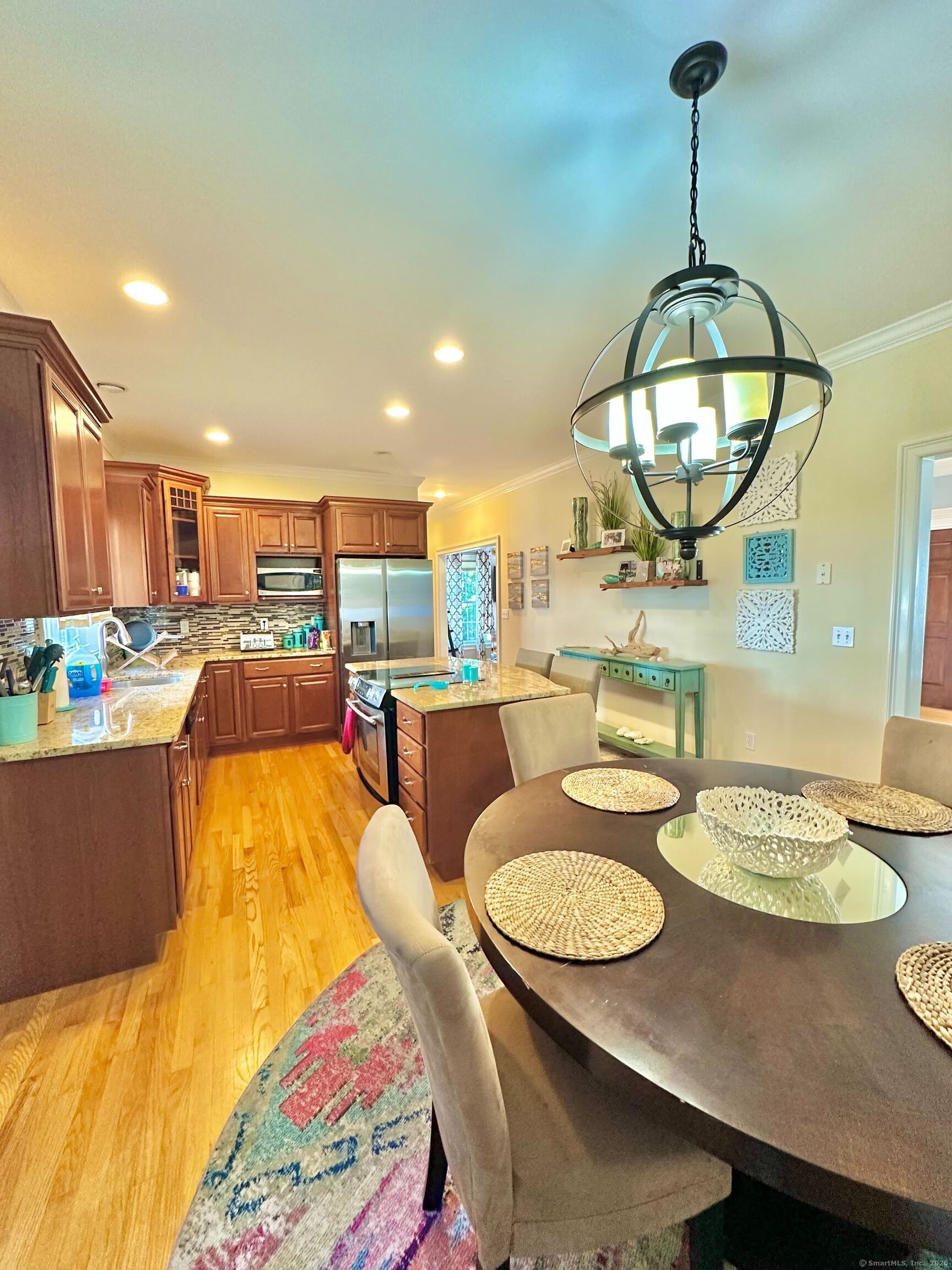 564 Black Rock Turnpike, Unit 564 Fairfield, CT 06825 - Photo 6 of 24 a living room with dining table and couches
