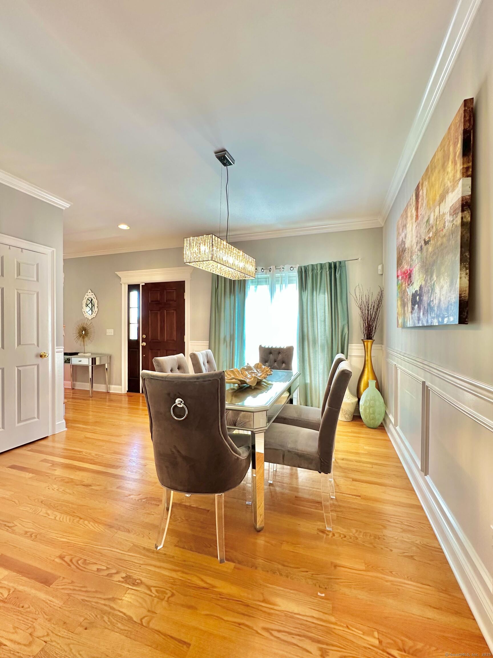 564 Black Rock Turnpike, Unit 564 Fairfield, CT 06825 - Photo 7 of 24 a living room with furniture a flat screen tv and a dining table