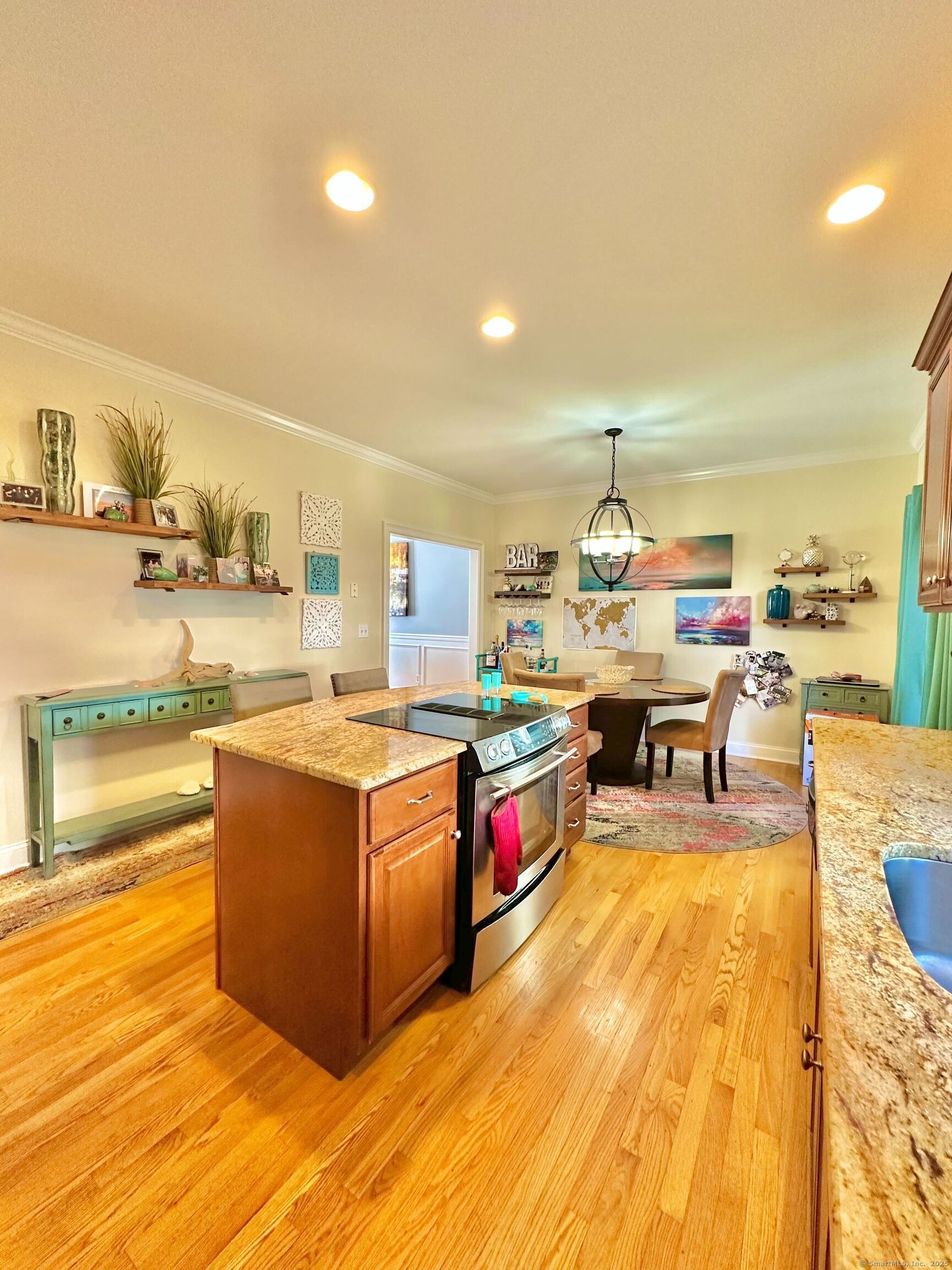 564 Black Rock Turnpike, Unit 564 Fairfield, CT 06825 - Photo 8 of 24 a living room with stainless steel appliances kitchen island granite countertop a sink and a stove