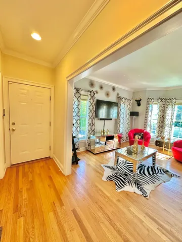 a living room with furniture and a table