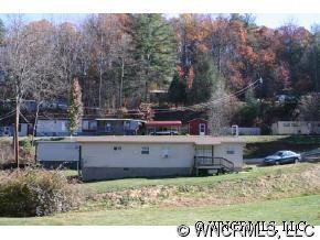 35 Castle Drive Clyde, NC 28721 - Photo 2 of 2 a view of a park with large trees