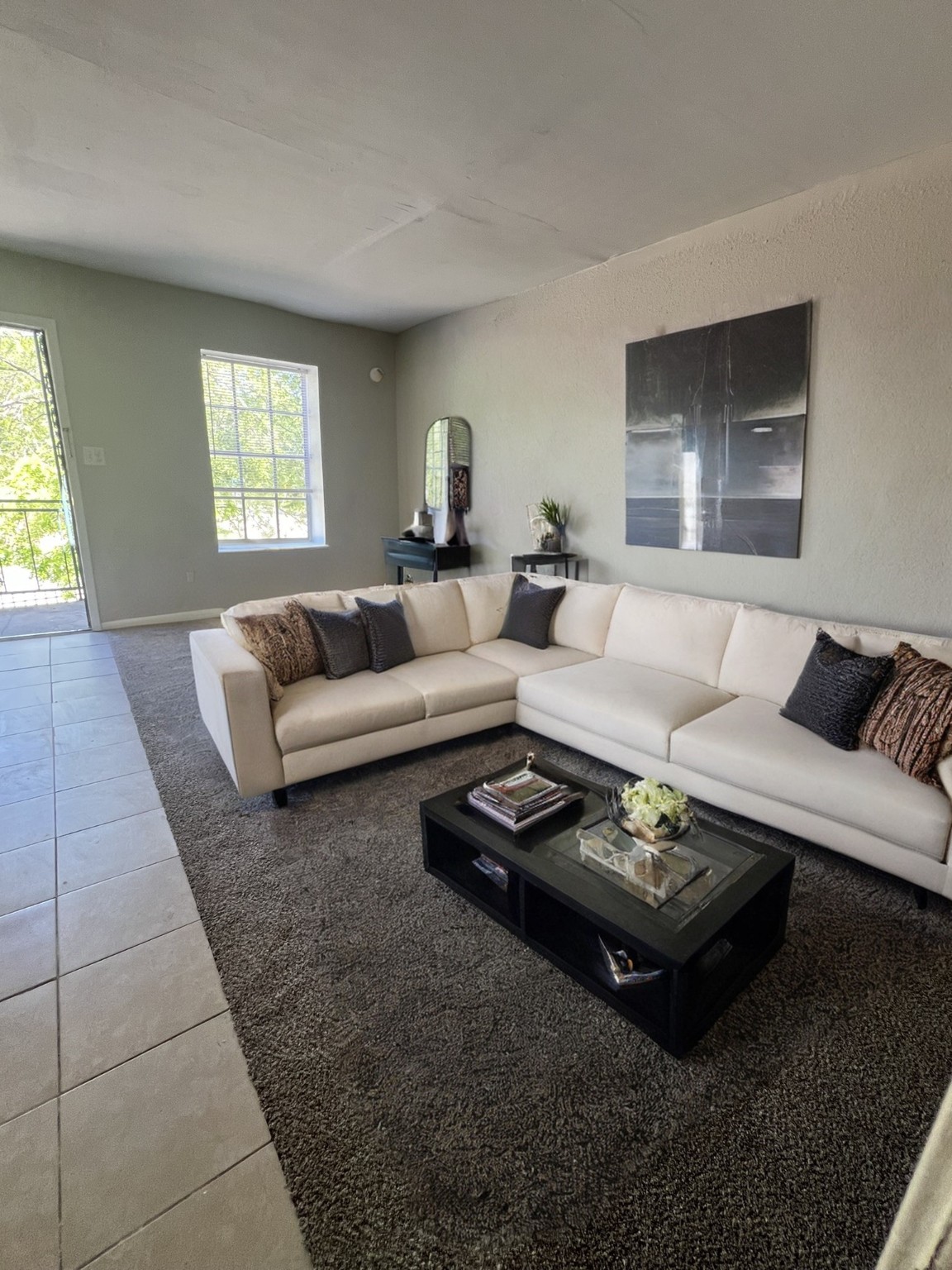 9745 Long Point Road, Unit 2 Houston, TX 77055 - Photo 3 of 7 a living room with furniture a rug and a window