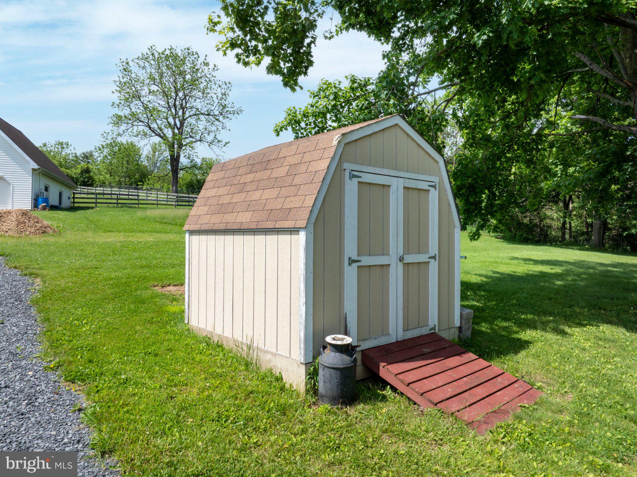 1639 Houserville Road State College, PA 16801 - Photo 52 of 54 Charming garden shed in lush greenery.