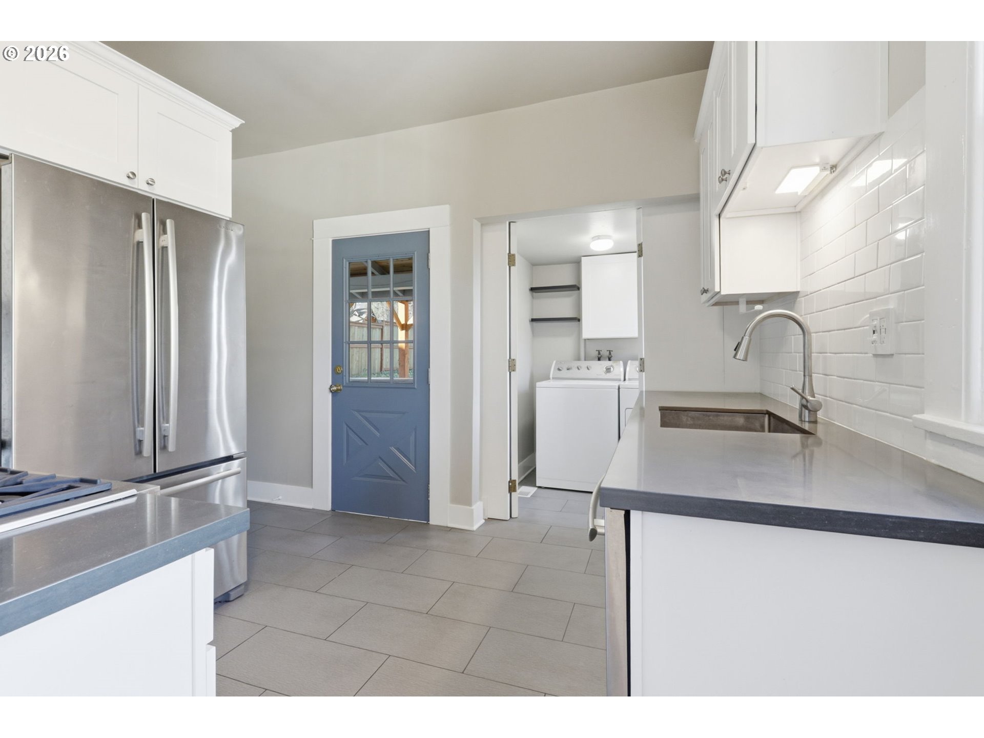25 Southeast 76th Avenue Portland, OR 97215 - Photo 18 of 48 a kitchen with stainless steel appliances granite countertop a refrigerator and a sink