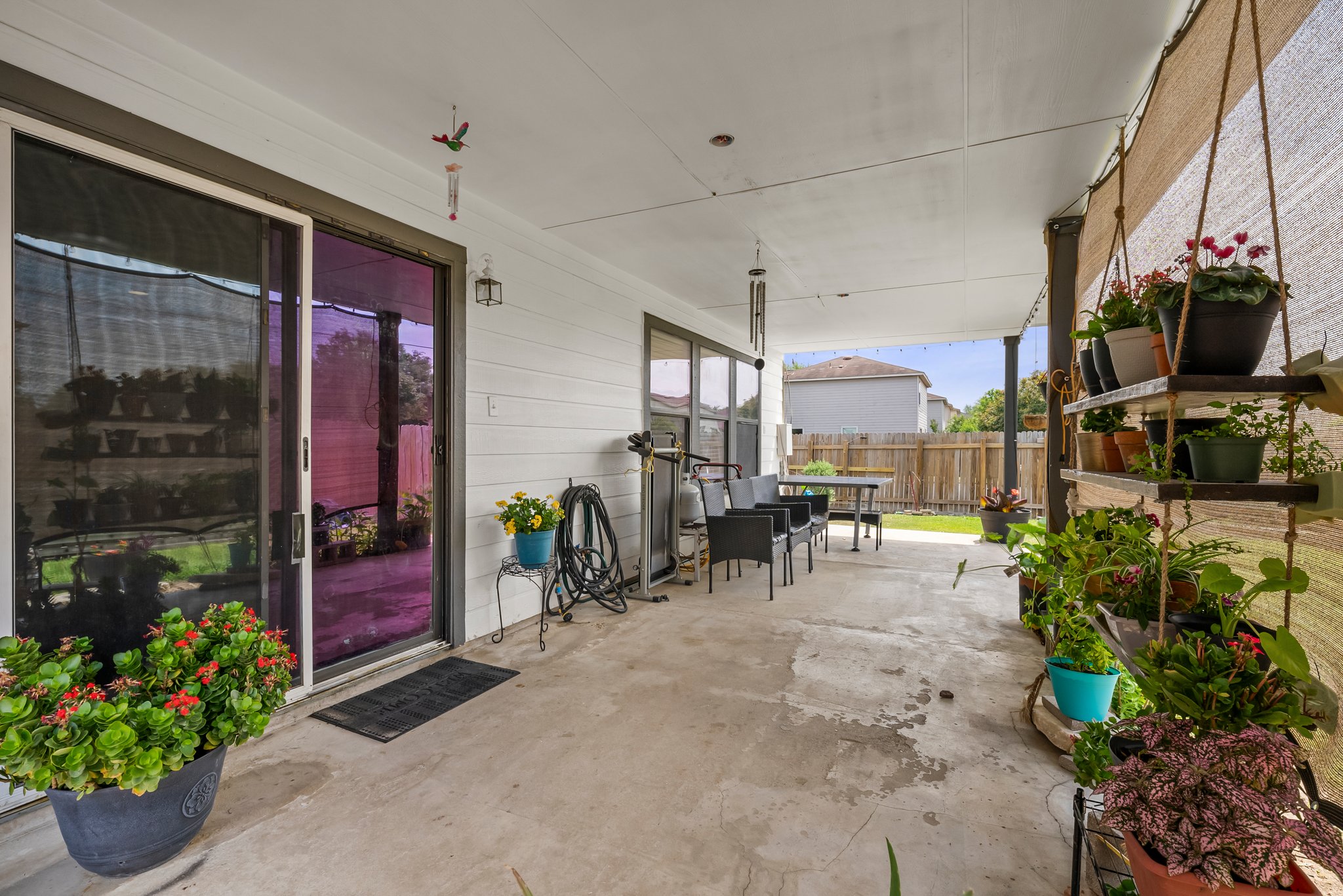 6829 Walkup Lane Austin, TX 78747 - Photo 16 of 18 A spacious covered patio offers ample room for entertaining and enjoying the outdoors.