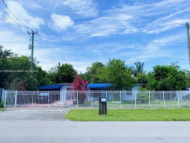 a view of a yard with a fence