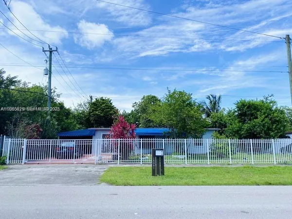 a view of a yard with a fence