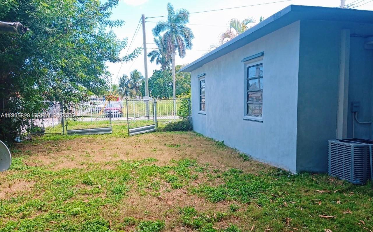 15061 Southwest 296th Street Homestead, FL 33033 - Photo 14 of 15 a view of a backyard with small cabin