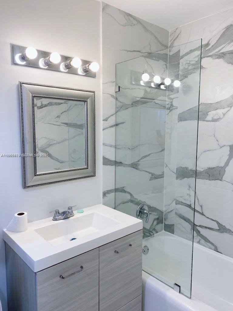 15061 Southwest 296th Street Homestead, FL 33033 - Photo 7 of 15 a bathroom with a sink a toilet and bathtub
