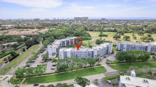 an aerial view of a house with a lake view