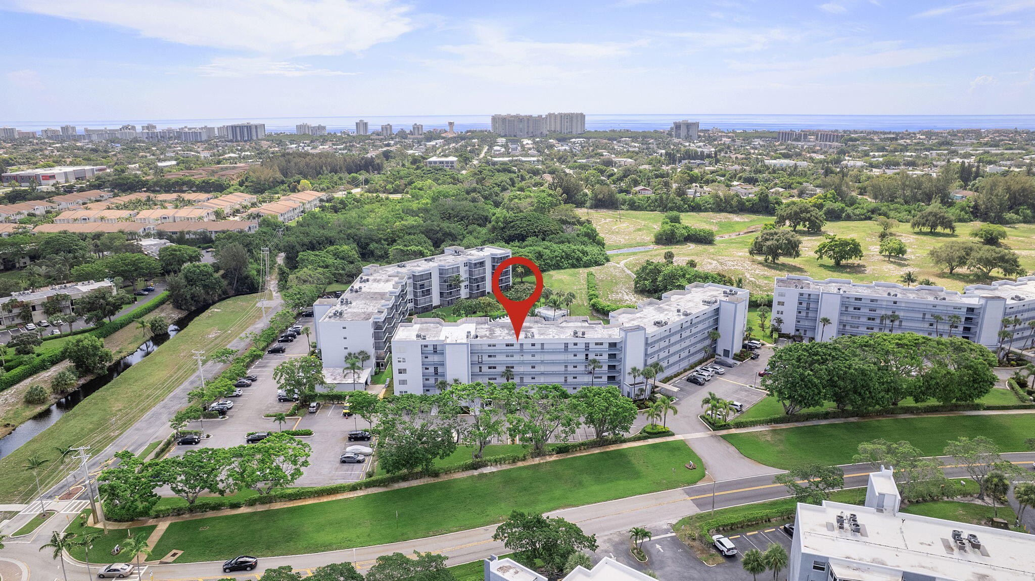an aerial view of a house with a lake view