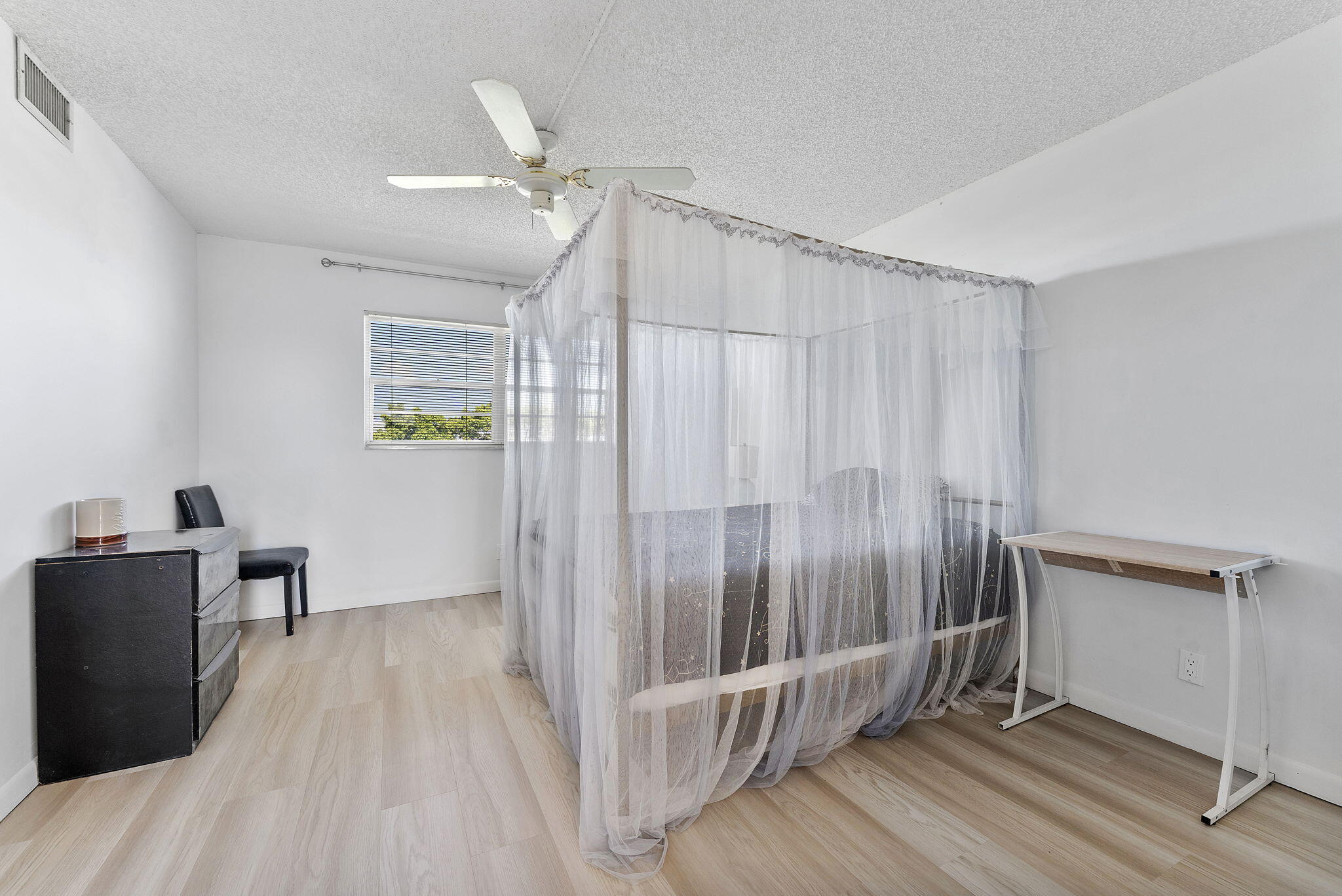 6500 Northwest 2nd Avenue, Unit 511 Boca Raton, FL 33487 - Photo 19 of 28 a view of a hallway with wooden floor and staircase