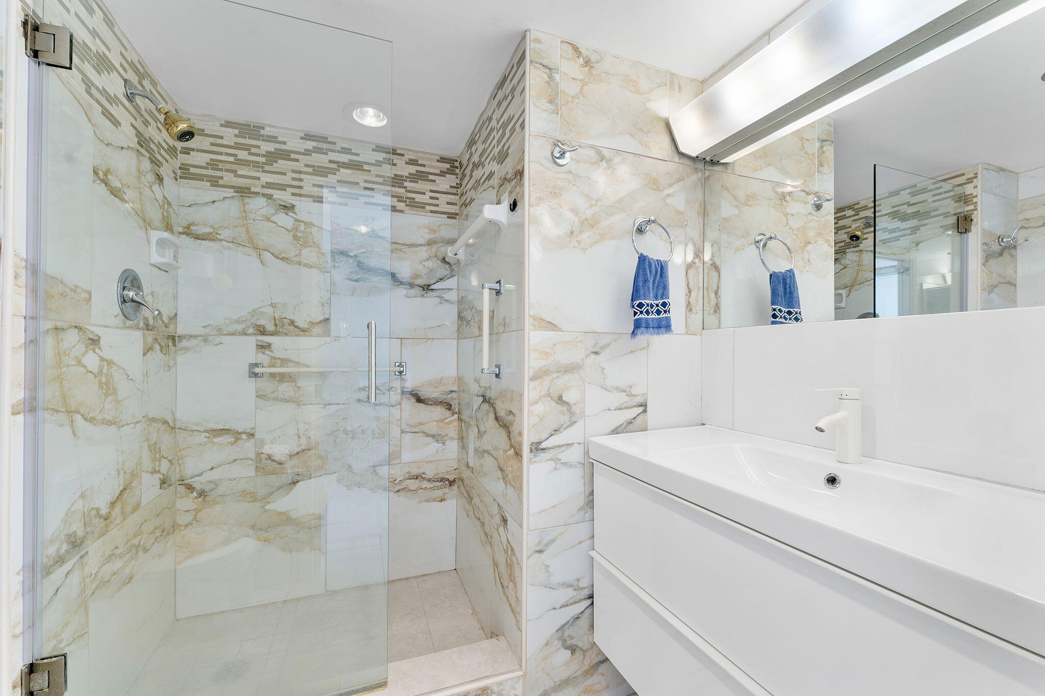 6500 Northwest 2nd Avenue, Unit 511 Boca Raton, FL 33487 - Photo 21 of 28 a bathroom with a sink vanity and mirror