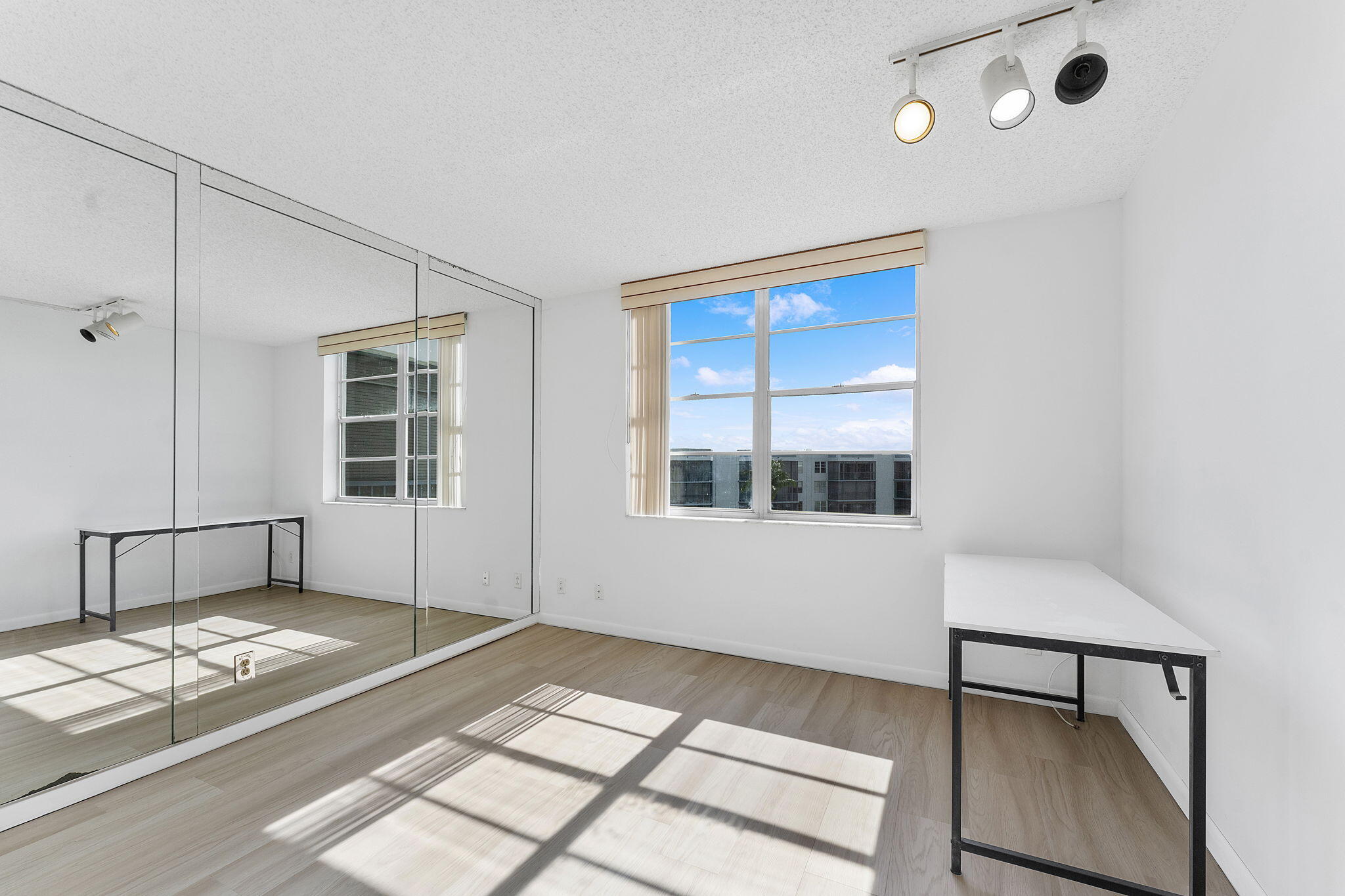 6500 Northwest 2nd Avenue, Unit 511 Boca Raton, FL 33487 - Photo 23 of 28 a view of a room that has a window and wooden floor