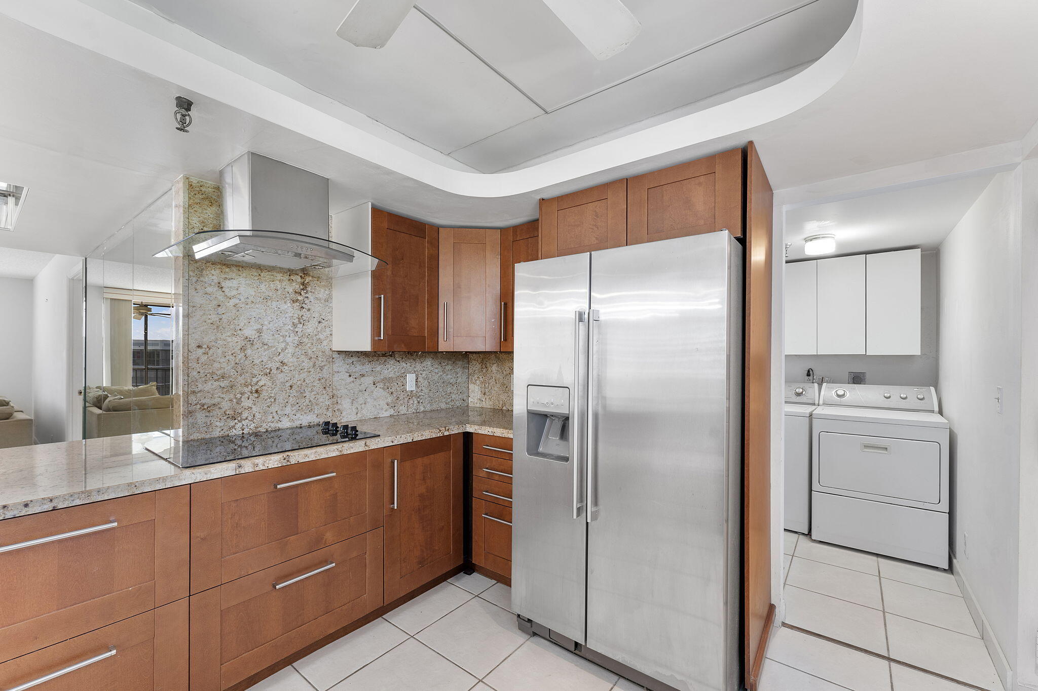 6500 Northwest 2nd Avenue, Unit 511 Boca Raton, FL 33487 - Photo 10 of 28 a kitchen with stainless steel appliances granite countertop a refrigerator a sink and white cabinets
