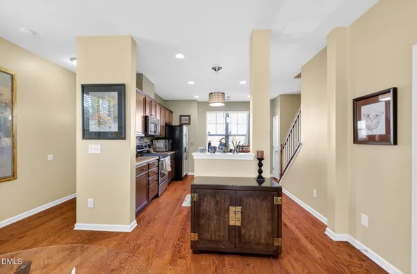 a kitchen with a refrigerator and a counter top space