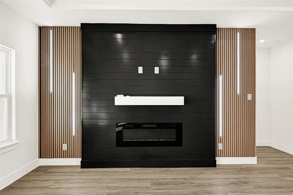 a kitchen with stainless steel appliances granite countertop a sink stove and wooden floor