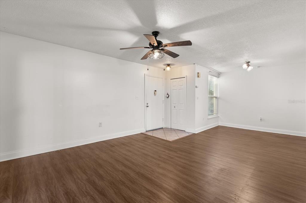 512 Orange Drive, Unit 32 Altamonte Springs, FL 32701 - Photo 11 of 16 wooden floor in an empty room