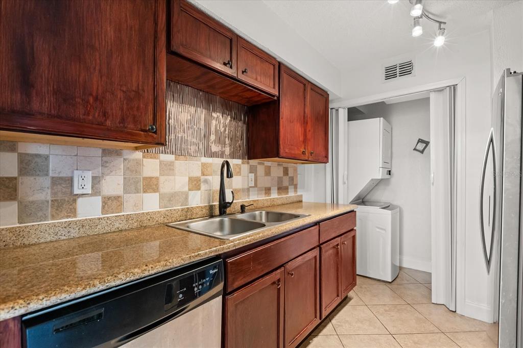 512 Orange Drive, Unit 32 Altamonte Springs, FL 32701 - Photo 14 of 16 a kitchen with a sink and a refrigerator
