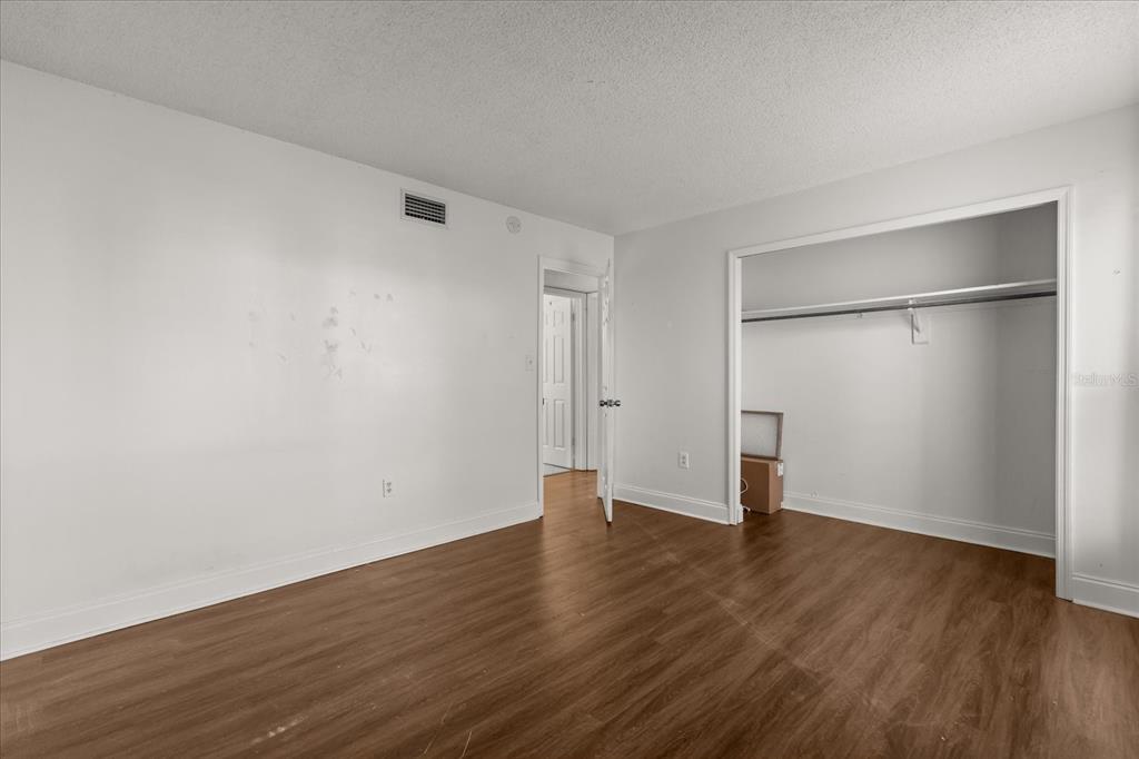 512 Orange Drive, Unit 32 Altamonte Springs, FL 32701 - Photo 5 of 16 a view of an empty room with wooden floor
