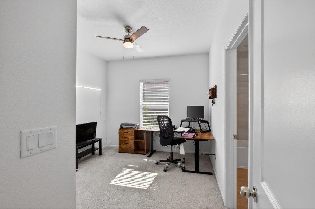 210 White Rabbit Run St. Augustine, FL 32092 - Photo 47 of 85 a view of a workspace with furniture and a window
