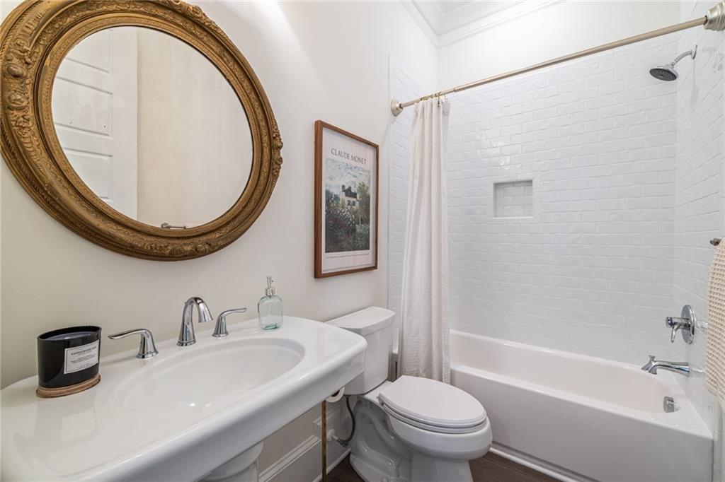 538 Ansley Street Decatur, GA 30030 - Photo 27 of 73 a bathroom with a sink a toilet and a mirror