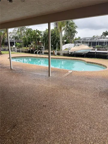 a view of a house with a swimming pool