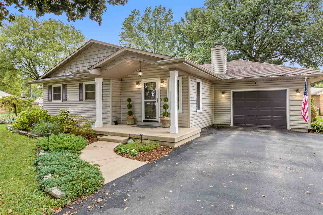 3917 Pinecrest Road Rockford, IL 61107 - Photo 1 of 40 a front view of a house with a yard and garage