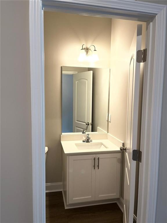 6185 Colston Lane, Unit 7 Tucker, GA 30084 - Photo 11 of 15 a bathroom with a sink and a mirror