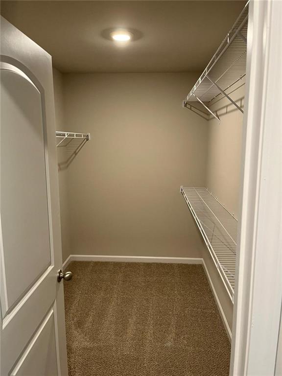 6185 Colston Lane, Unit 7 Tucker, GA 30084 - Photo 8 of 15 a view of a room with racks on the wall