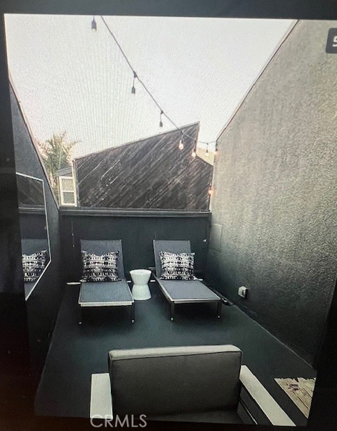 320 12th Street, Unit 5 Seal Beach, CA 90740 - Photo 12 of 18 a living room with furniture and a fireplace