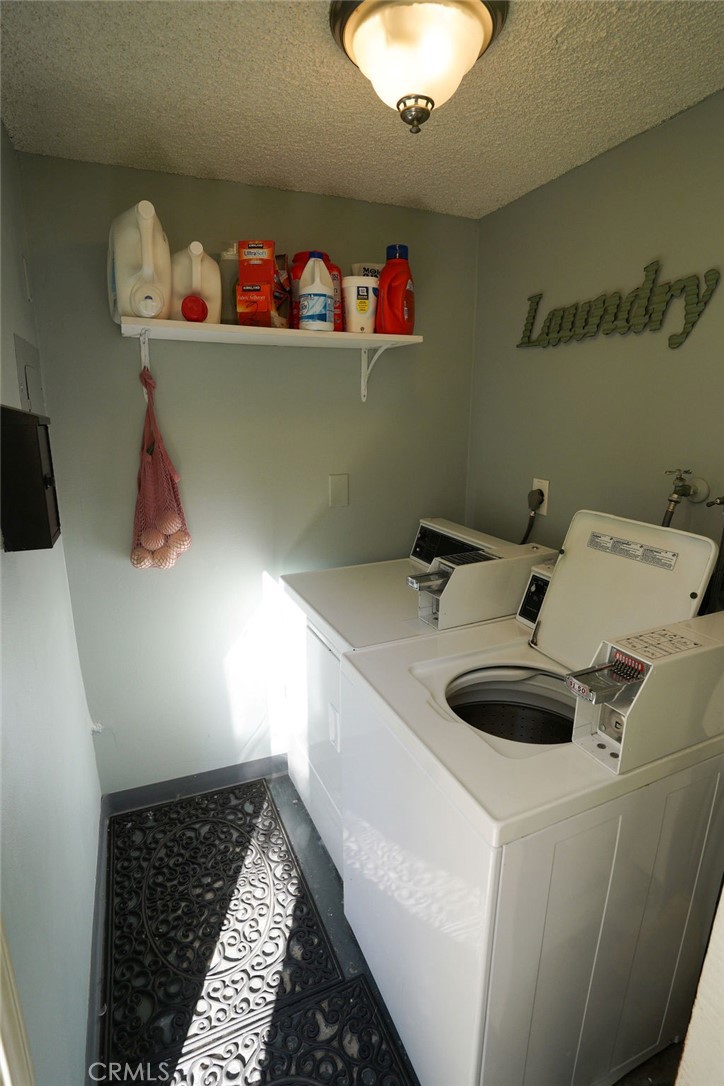 320 12th Street, Unit 5 Seal Beach, CA 90740 - Photo 15 of 18 a bathroom with a sink and a white stove