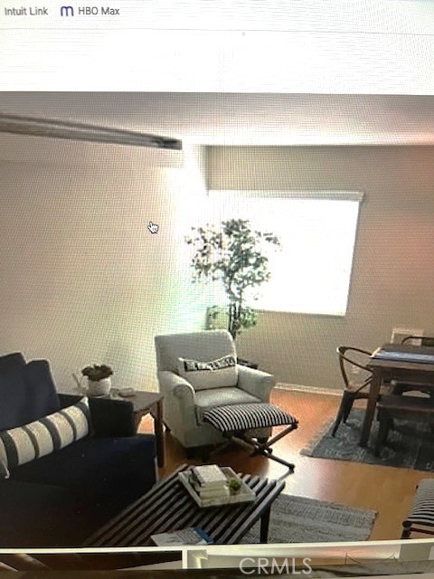 320 12th Street, Unit 5 Seal Beach, CA 90740 - Photo 7 of 18 a living room with furniture and a large window