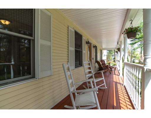 253 Stafford Road Monson, MA 01057 - Photo 4 of 24 a view of a patio with table and chairs with wooden floor and fence