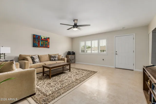 a living room with furniture and a window