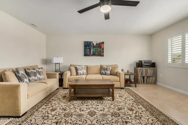 a living room with furniture and a rug