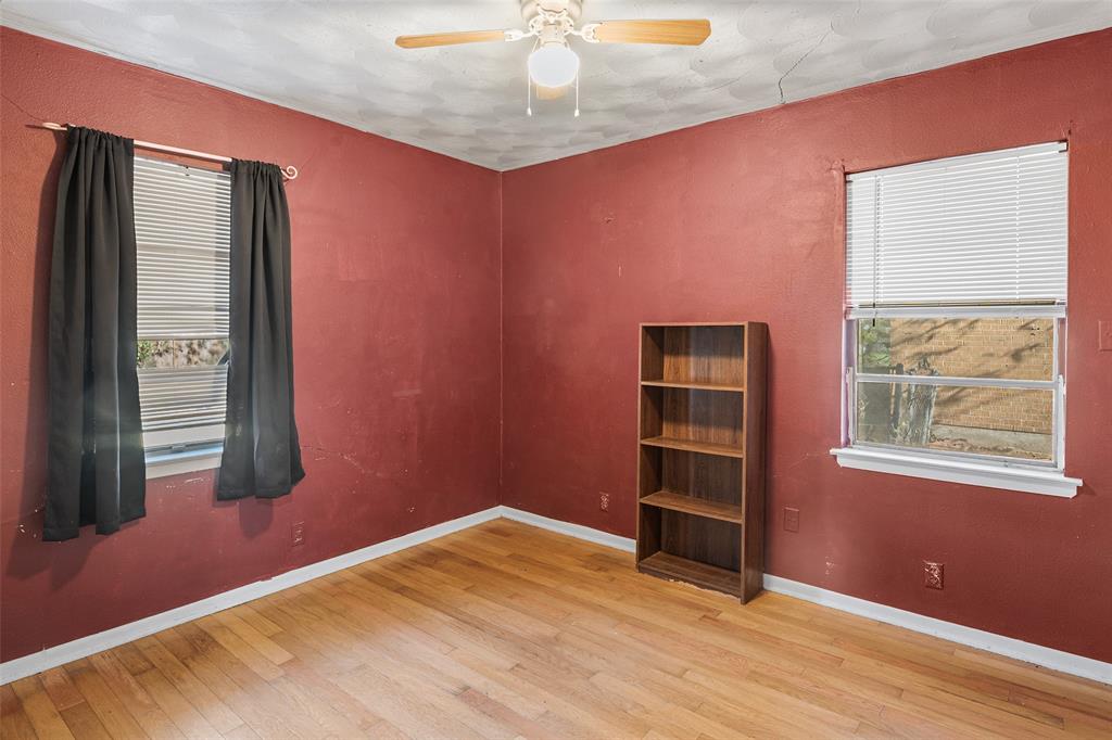 1129 Ridgeview Street Mesquite, TX 75149 - Photo 12 of 14 wooden floor and window in an empty room