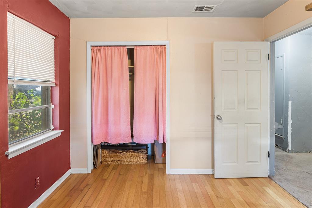 1129 Ridgeview Street Mesquite, TX 75149 - Photo 13 of 14 a room with wooden floor and a window
