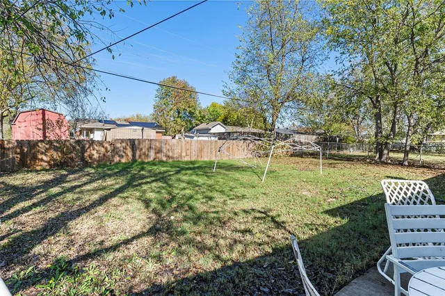 a view of backyard with green space