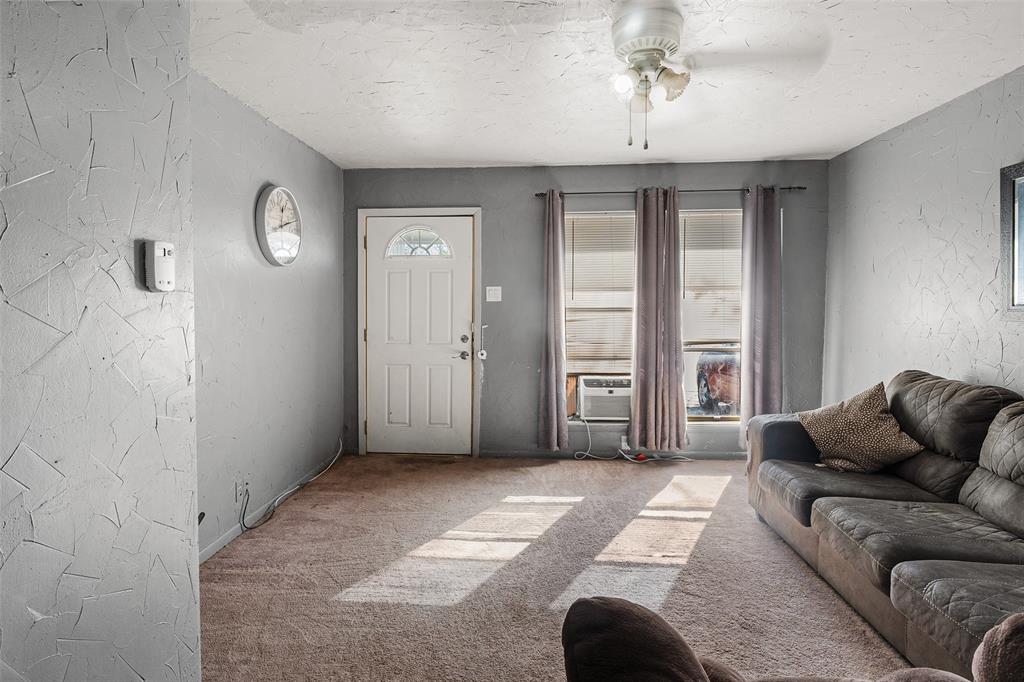 1129 Ridgeview Street Mesquite, TX 75149 - Photo 4 of 14 a living room with furniture and a window