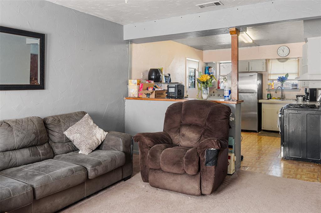 1129 Ridgeview Street Mesquite, TX 75149 - Photo 6 of 14 a living room with furniture and a large window