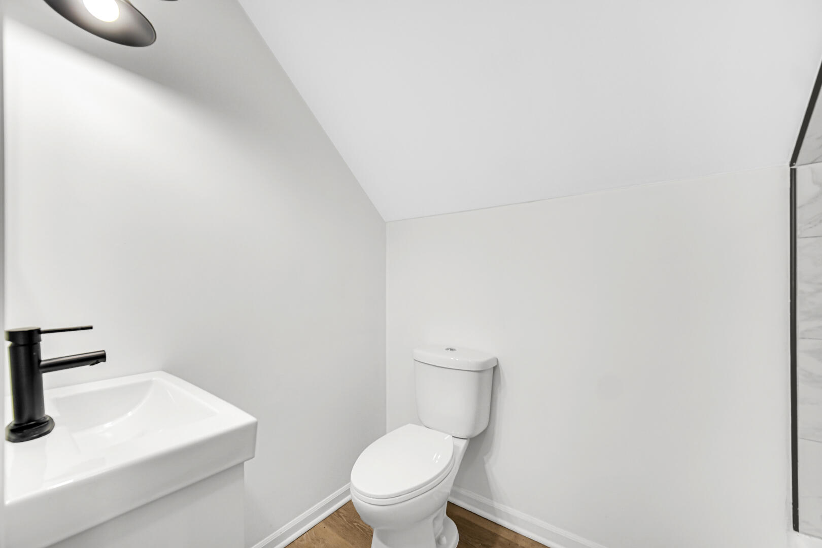 378 Raritan Drive Valparaiso, IN 46385 - Photo 25 of 28 a white toilet sitting next to a bathroom sink