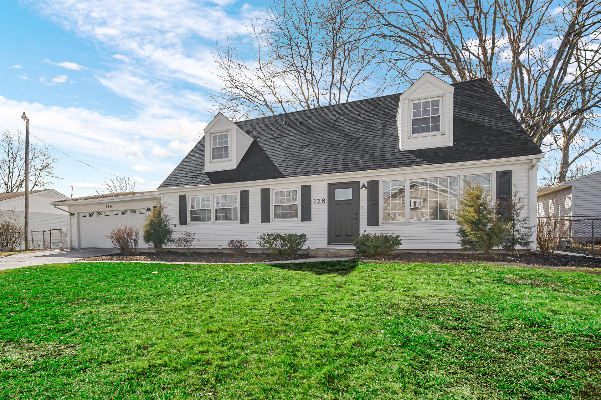 378 Raritan Drive Valparaiso, IN 46385 - Photo 3 of 28 a front view of a house with a yard and a tree