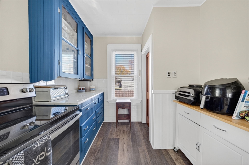 18 Maple Street Fairhaven, MA 02719 - Photo 14 of 39 a kitchen with stainless steel appliances granite countertop a stove and a sink