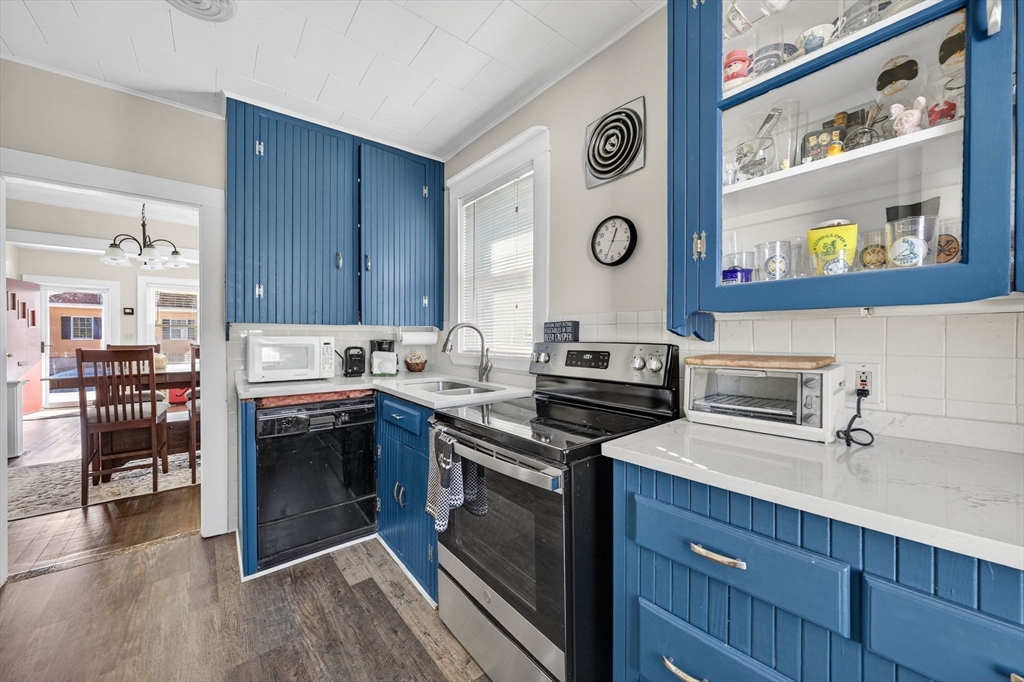 18 Maple Street Fairhaven, MA 02719 - Photo 15 of 39 a kitchen with stainless steel appliances granite countertop a stove and a sink
