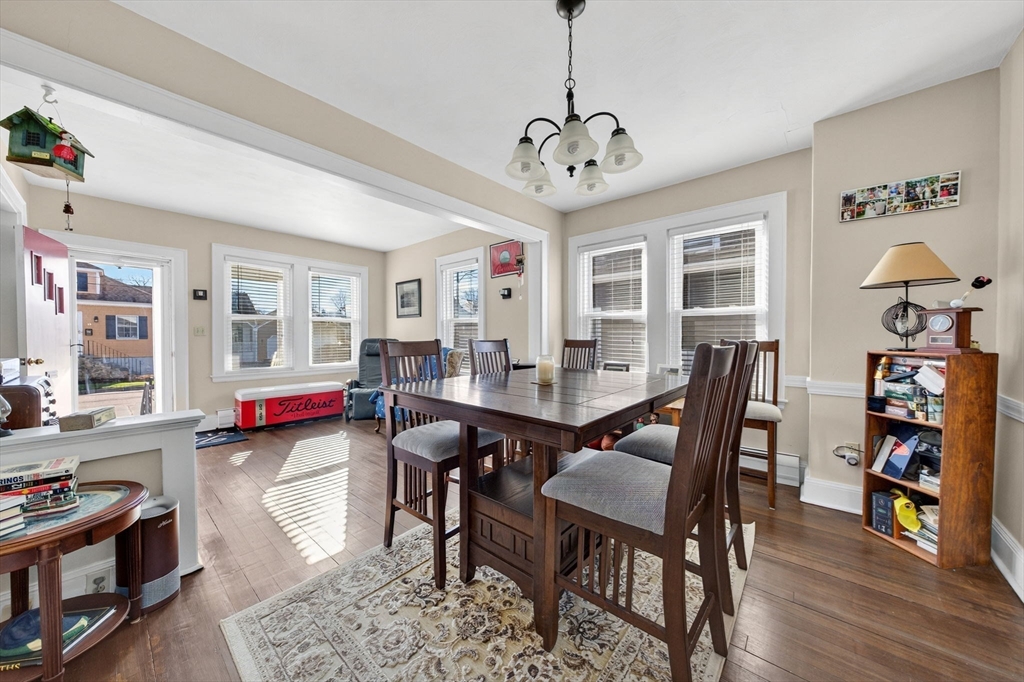 18 Maple Street Fairhaven, MA 02719 - Photo 16 of 39 a view of a dining room with furniture wooden floor and a chandelier